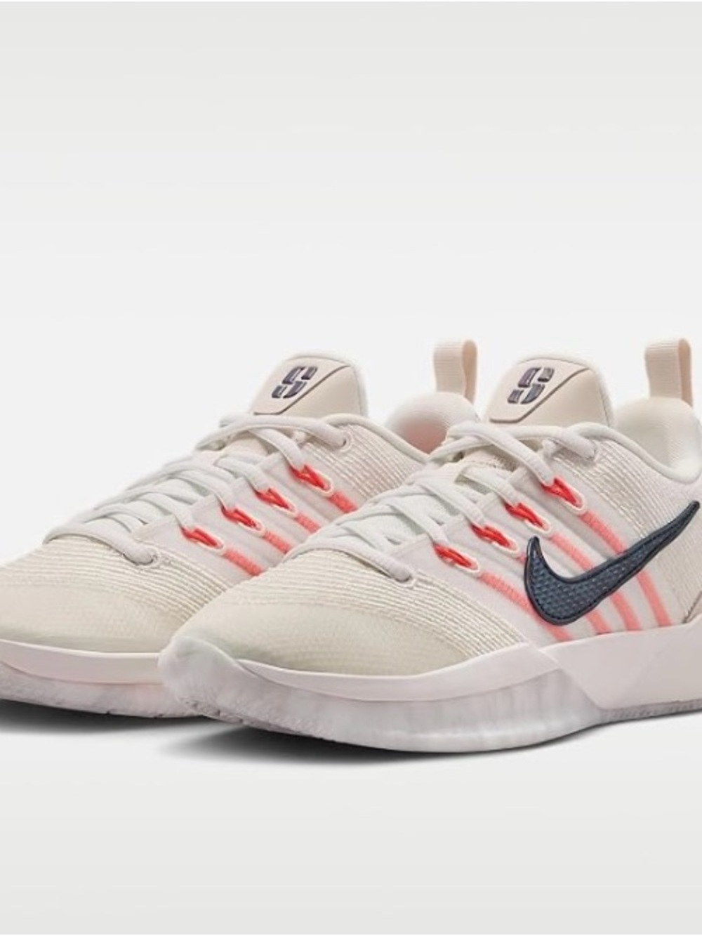 Nike Women's White Sneakers with Orange Accents and Black Swoosh